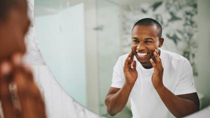 Man smiling in the mirror
