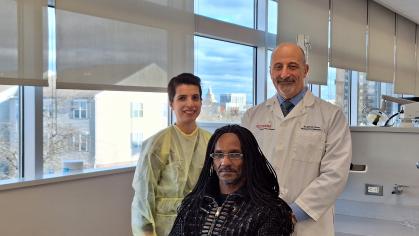 Eugene Brown in the clinic with his doctors