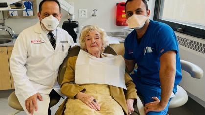 Photo of Professor of Restorative Dentistry Peter L. DeSciscio ’85 (left), Yelena Olshansky, and Ivan Alkhwekhi ’23