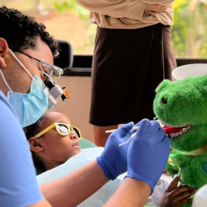 Student showing how to floss